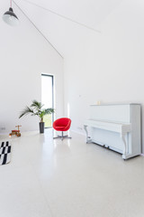 White living room with piano