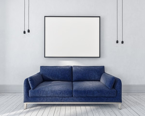 Blue couch in a monochrome grey room