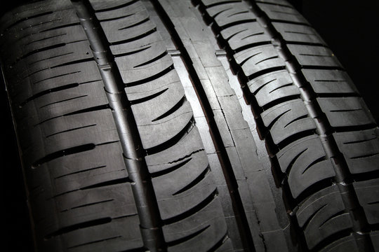 Close image of tire tread patterns on new tires.