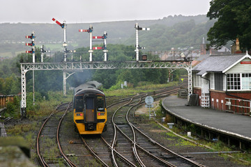 Railway station and junction with analogue signalling units.