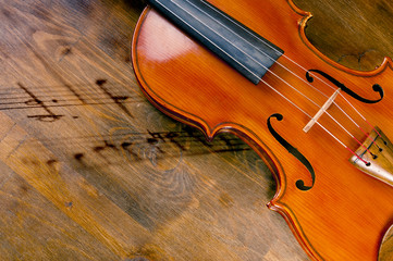 Violin with notes on the table. Multi-Exposure