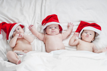 Three cute newborn Santa - 133804889
