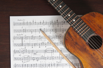 Plakat Music notes, vintage guitar and two pencils on table