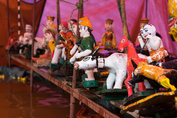 Common Vietnamese water puppets behind puppetry state. The control room is dark to hide puppeteers...