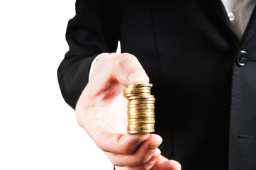 man in a suit holding coins in the hand
