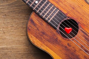 Valentines Day background with hearts on vintage guitar