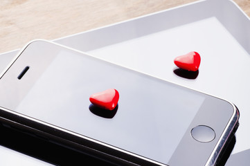 heart on the tablet and phone