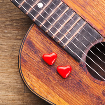 Valentines Day background with hearts on vintage guitar