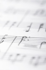 Handwritten musical notes, shallow DOF