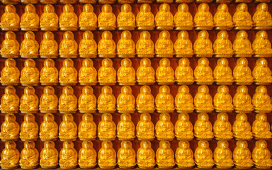 Fototapeta premium Buddha gold statue chinese architecture on the wall ,Wat Mangkon Kamalawat ,Chinese style Temple in Thailand