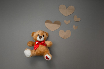 Teddy bear and paper hearts