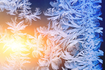 Frosty patterns on glass. Winter background.