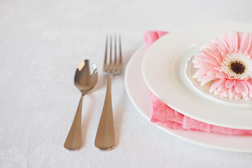 Valentine's Day pink decorated table setting for romantic dinner
