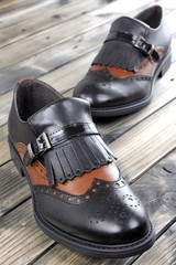 Women's shoes on old wooden table.
