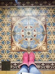 Standing on colorful pattern tiles in one of the houses in Prague 2. 