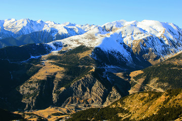 The mountain tops covered with snow.