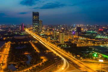 Fototapeta na wymiar Aerial skyline view of Hanoi cityscape at twilight. Thang Long freeway and Pham Hung street