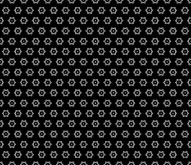 Fototapeta na wymiar Vector seamless pattern, subtle abstract background with black & white hexagons, simply snowflakes. Floral geometric texture, stylish dark minimalist backdrop. Design for prints, textile, decoration