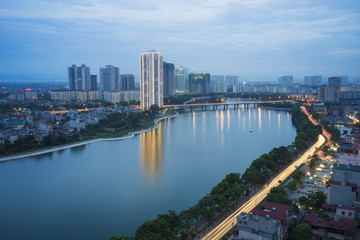 Fototapeta na wymiar Hanoi skyline cityscape at twilight period. Linh Dam lake