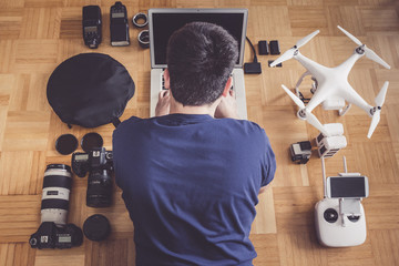 Photographer With Lots Of Equipment Planning His Next Shoot