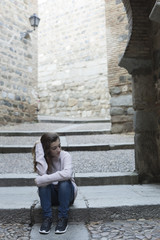 Young woman sitting on the steps