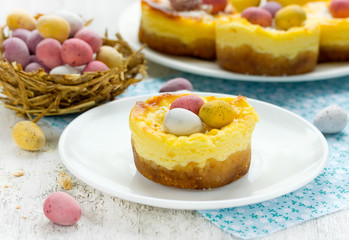 Easter nest cakes with colorful chocolate candy eggs