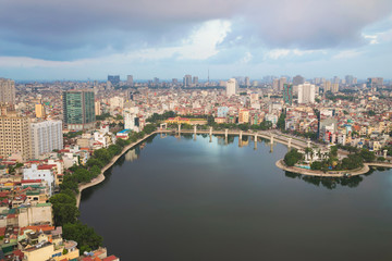 Fototapeta na wymiar Aerial view of urban skyline at twilight. Hanoi cityscape. Dong Da lake view