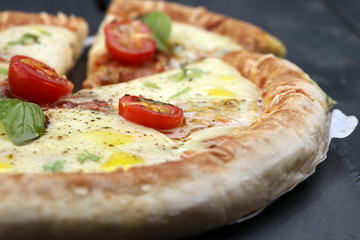 Hot true PEPPERONI ITALIAN PIZZA with salami and cheese. TOP VIEW Tasty traditional pepperoni pizza on board on wooden table with decoration
