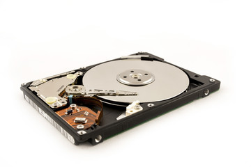 Laptop HDD on the white background. Disassembled hard disk (without top cover). inside view of notebook hard disk.