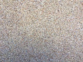Texture of a wall with small pieces of gravel