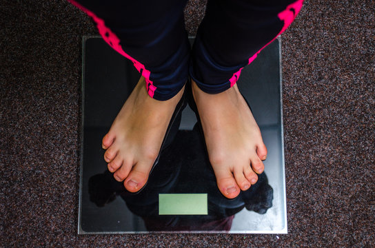 Female feet on scales