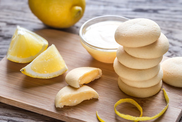 Biscuits filled with lemon cream on the wooden board