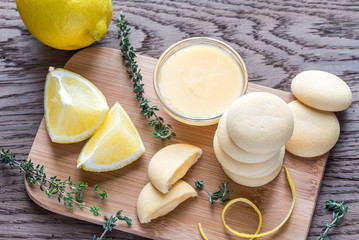 Biscuits filled with lemon cream on the wooden board