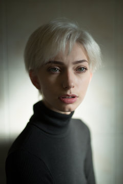 Portrait of blonde woman wearing turtleneck