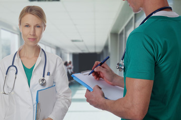 Health care and medical concept. Portrait an unknown female doctor with a stethoscope in hospital background.