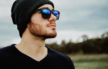 Handsome cool young man with sunglasses