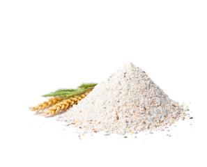 Heap  of wholemeal bread flour with wheat ear isolated on white