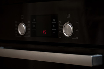 control knobs and display modern electric stove