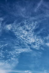 Fototapeta premium Clear blue sky with gentle soft clouds