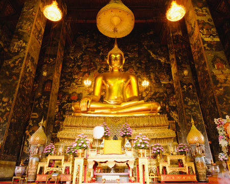 Public place Big Buddha gold statue with thai art architecture  in church at Wat Suthat temple. This is a Buddhist temple in Bangkok .