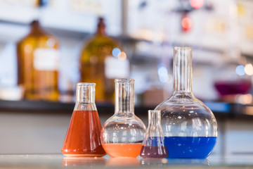 Beaker with colorful liquid in the laboratory