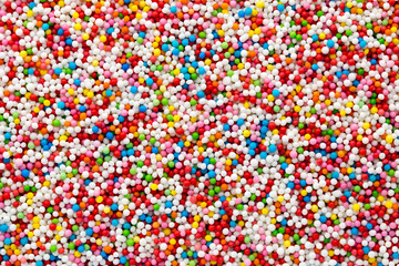 Fototapeta na wymiar Multicoloured sweet sugar balls. Small ball pattern.