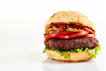 Freshly made beef burger with tomatoes on white