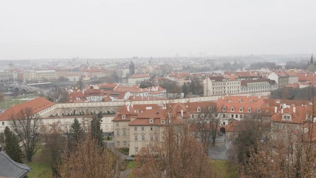 Zooming out rooftop famous spires and domes in capital of Czechia 3840X2160 UHD footage - Cloudy day cityscape of Czech Republic Prague 2160p UltraHD video 