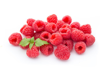 Ripe raspberry with leaf isolated on the white background.