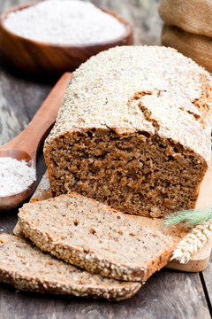 Homemade  rye bread with wholemeal bread flour on wooden table