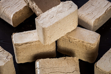 stacked wooden briquettes