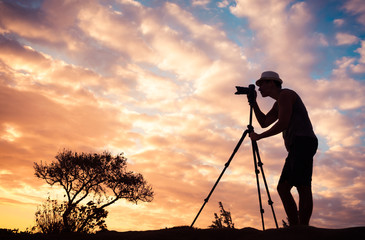 Photographer taking pictures in a beautiful nature setting. 