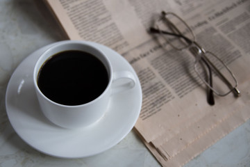 Morning coffee with newspaper. background layout with free text space. Flat lay composition (top view)