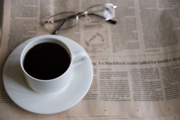 Morning coffee with newspaper. background layout with free text space. Flat lay composition (top view)